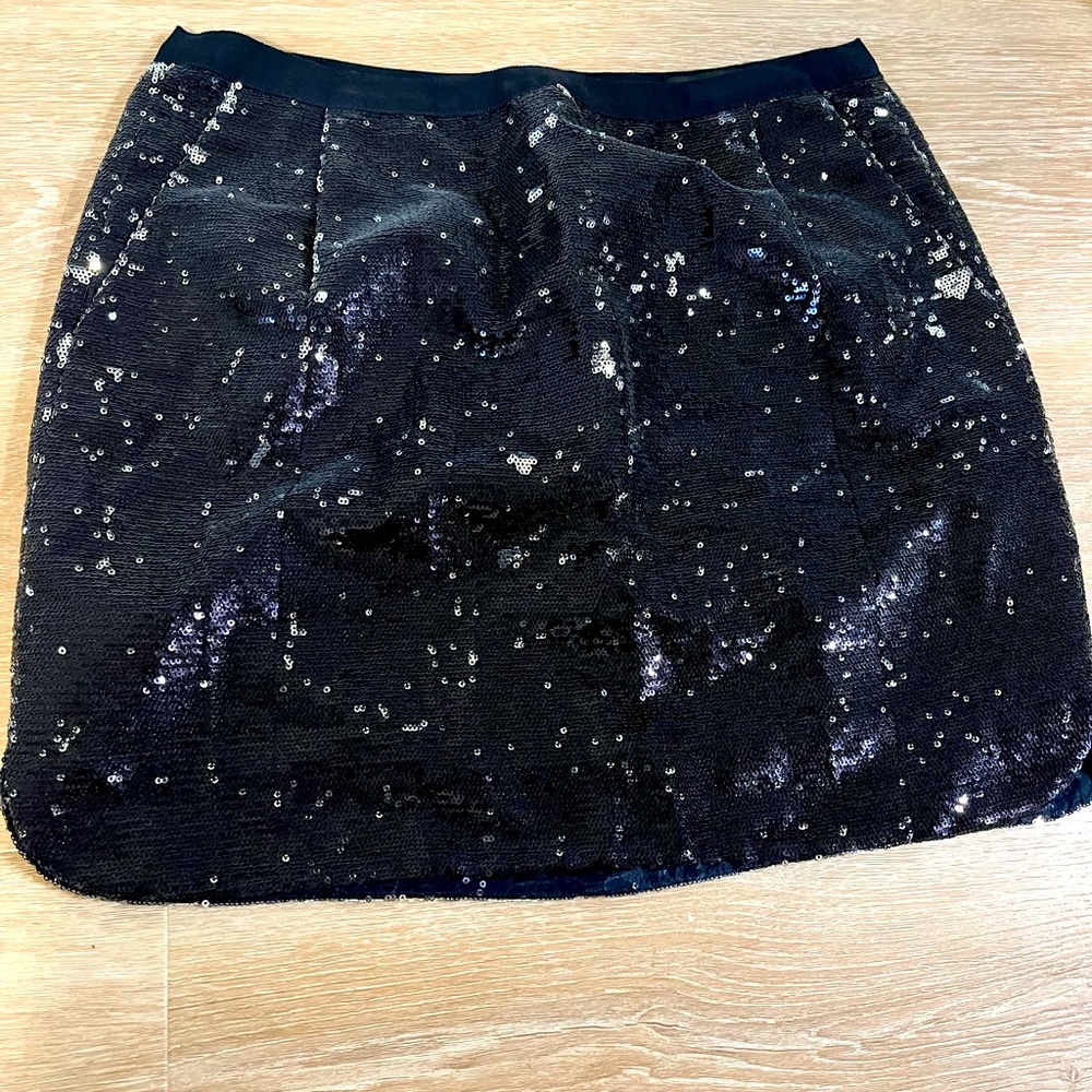J. Crew sequin skirt with a shirt tail hem and pockets